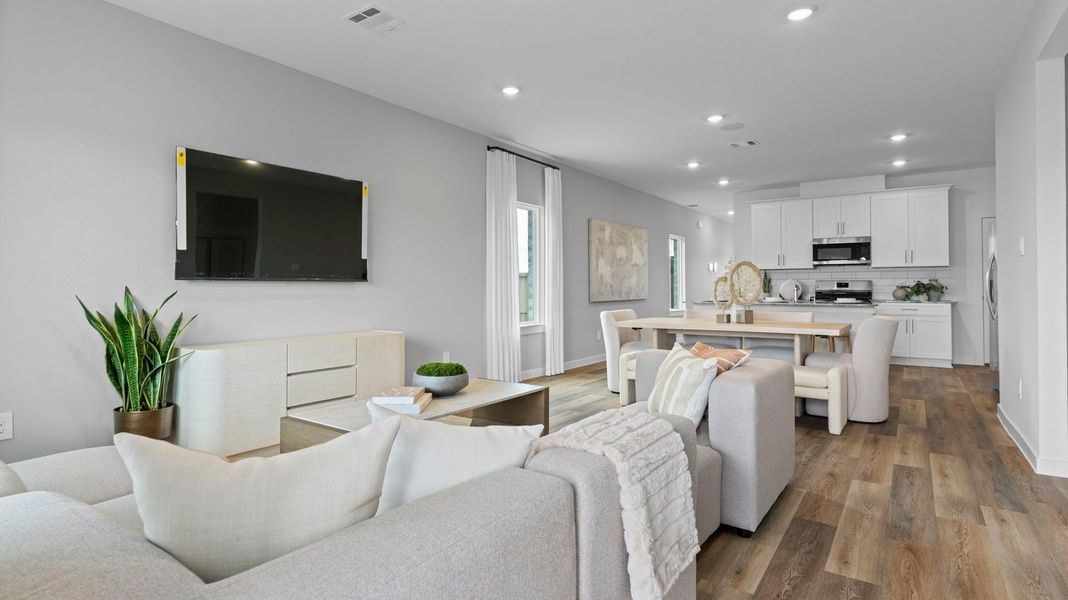 Furnished interior view inside a new home in Caldwell Crossing, Iowa Colony (Image 6).
