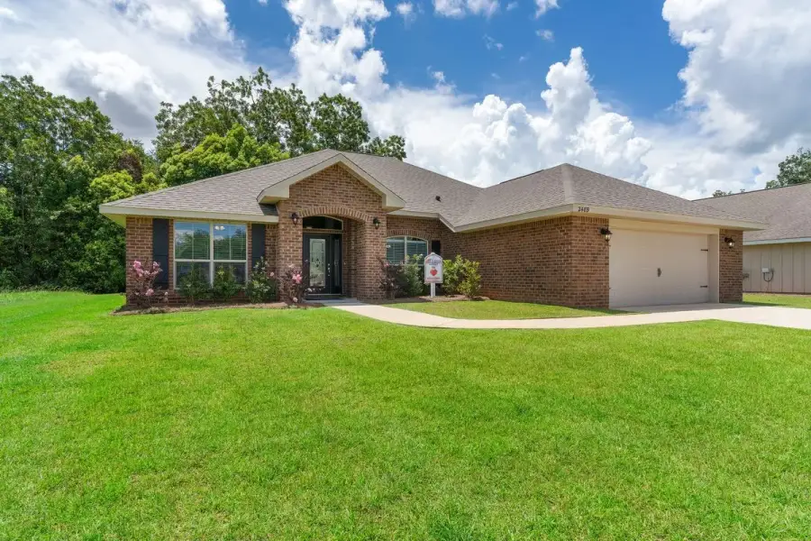 Representative exterior photo of a completed home built from the 2265 by Adams Homes in Flagler Estates, Hastings, FL (Image 40).