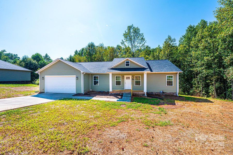 Front exterior of a new home in , Newton, NC, highlighting curb appeal (Image 19).