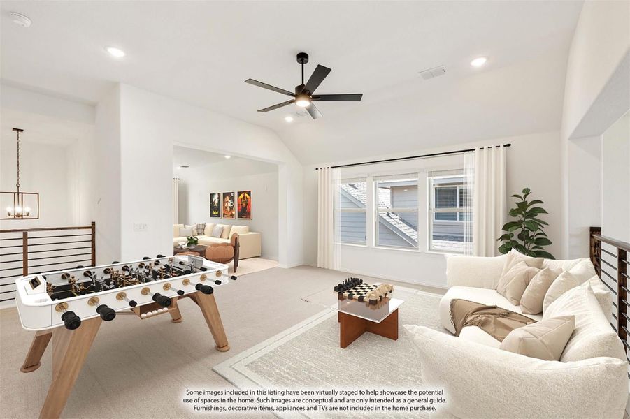 Bonus room with foosball table, sectional sofa, vaulted ceiling, and ceiling fan over carpeted floor