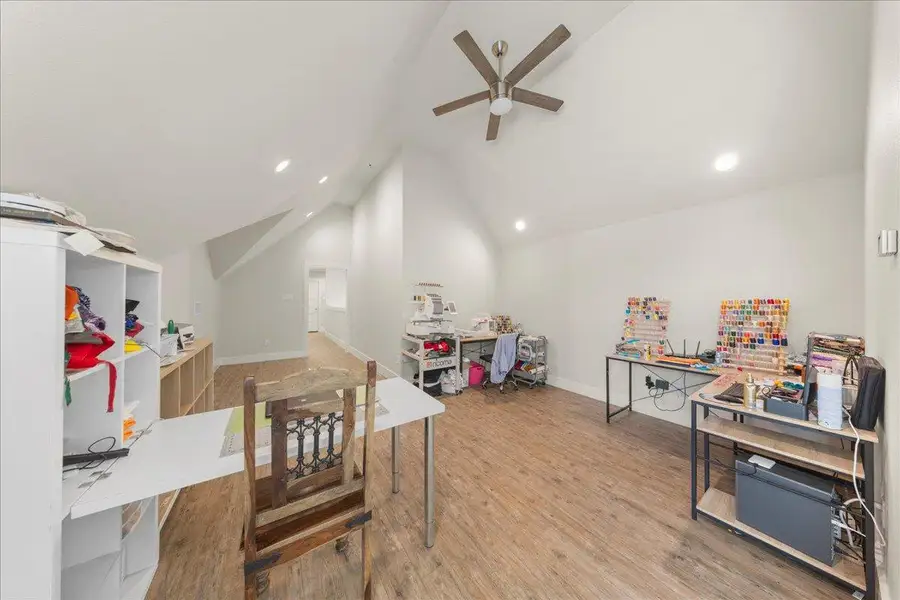 Rec room featuring wood finished floors, vaulted ceiling, recessed lighting, and ceiling fan Rec room featuring wood finished floors, vaulted ceiling, recessed lighting, and ceiling fan