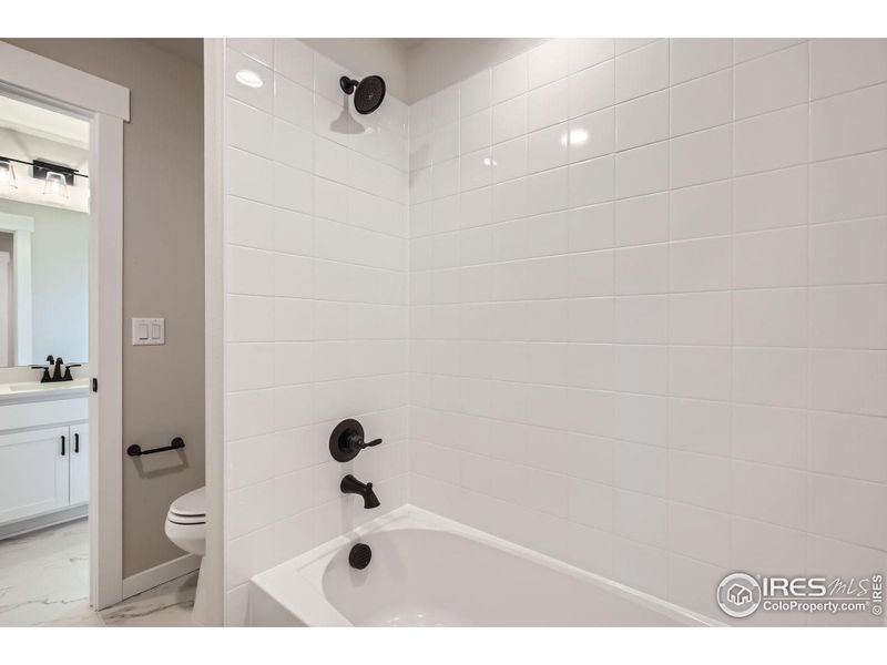 Furnished interior view inside a new home in RainDance - 60s, Windsor (Image 31).