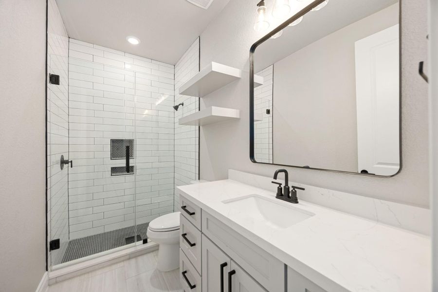 Shared bathroom located conveniently between the two downstairs secondary bedrooms