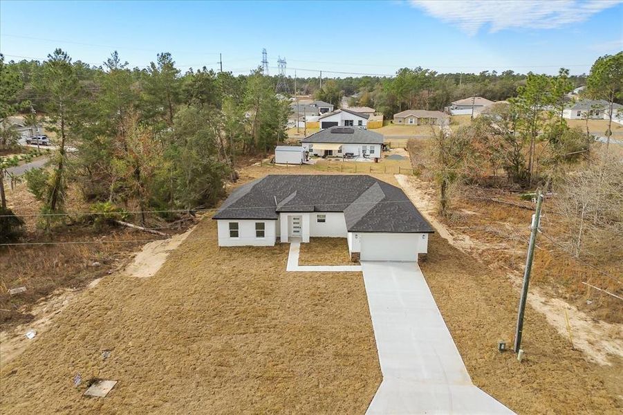 Front exterior of a new home in , Ocala, FL, highlighting curb appeal (Image 18).