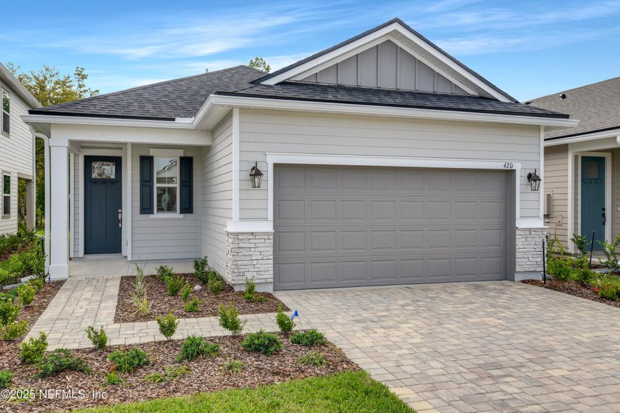 Front exterior of a new home in Elm Creek at Silverleaf, St. Augustine, FL, highlighting curb appeal (Image 1). Front exterior of a new home in Elm Creek at Silverleaf, St. Augustine, FL, highlighting curb appeal (Image 1).