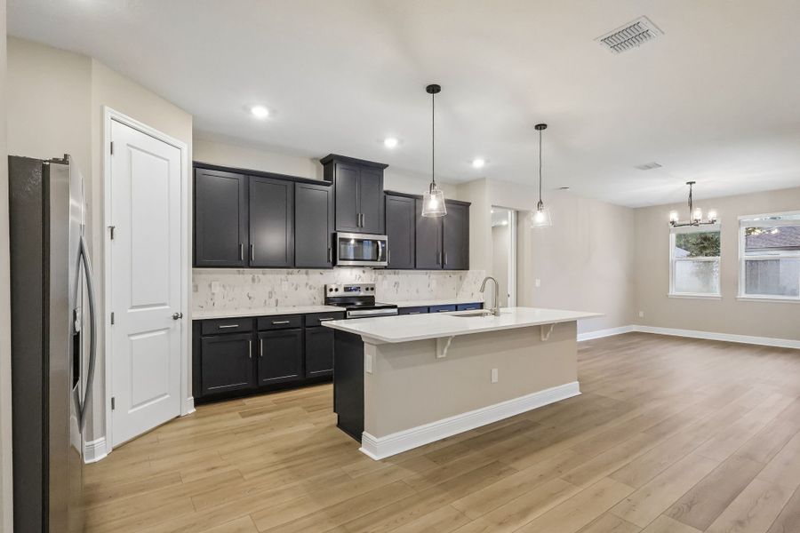 Furnished interior view inside a new home in Legends Preserve - Signature Series, Daytona Beach (Image 3).