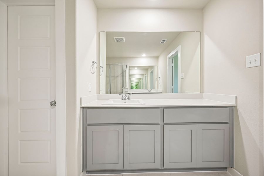 Primary Bathroom in the Harrison home plan by Trophy Signature Homes