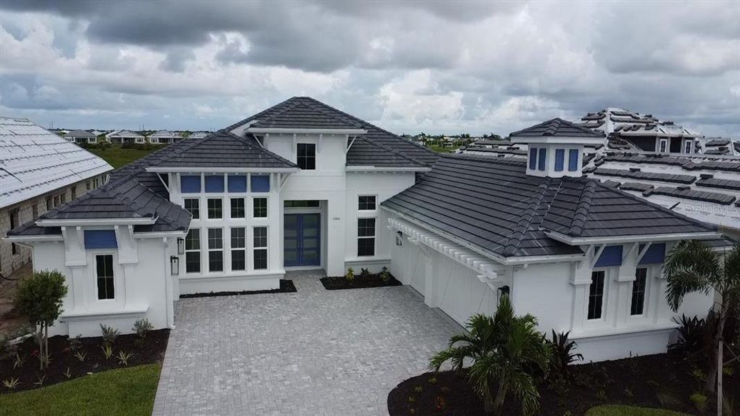 Front exterior of a new home in , Venice, FL, highlighting curb appeal (Image 1). Front exterior of a new home in , Venice, FL, highlighting curb appeal (Image 1).
