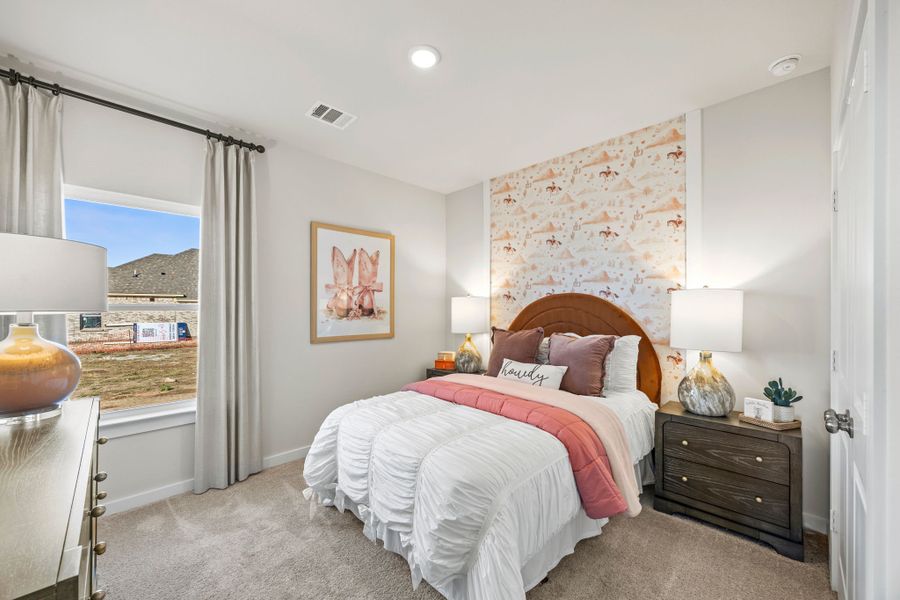 A bedroom with a bed and a window. A bedroom with a bed and a window.