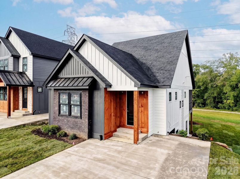 Front exterior of a new home in , Hendersonville, NC, highlighting curb appeal (Image 1). Front exterior of a new home in , Hendersonville, NC, highlighting curb appeal (Image 1).