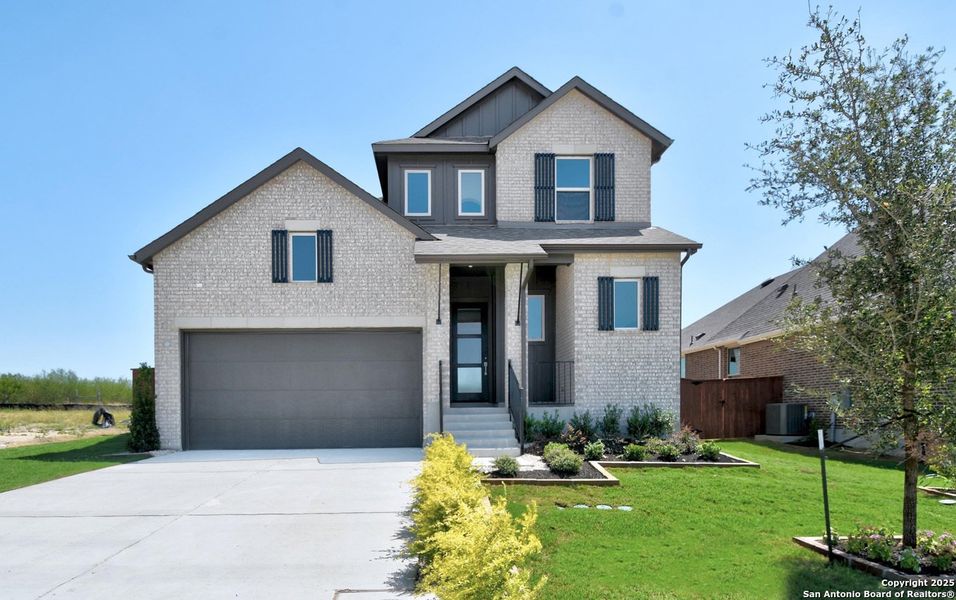 Front exterior of a new home in Homestead, Schertz, TX, highlighting curb appeal (Image 1).