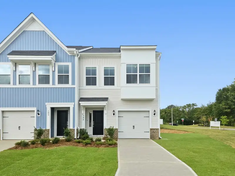 Front exterior of a new home in West Main Townhomes, Sanford, NC, highlighting curb appeal (Image 1). Front exterior of a new home in West Main Townhomes, Sanford, NC, highlighting curb appeal (Image 1).