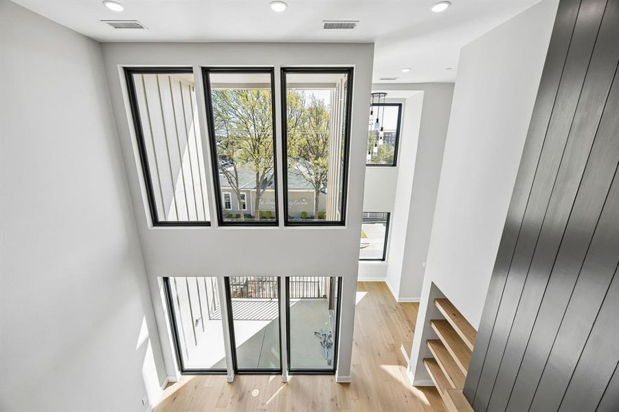 Stairway with wood finished floors and recessed lighting Stairway with wood finished floors and recessed lighting
