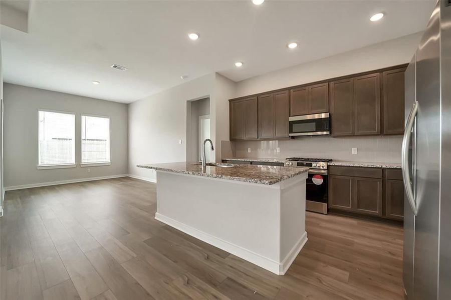 Furnished interior view inside a new home in Sunterra, Katy (Image 31).