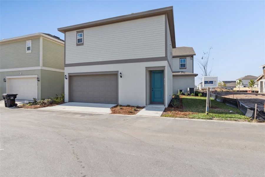 Front exterior of a new home in Laureate Park (Craft Homes), Orlando, FL, highlighting curb appeal (Image 21).
