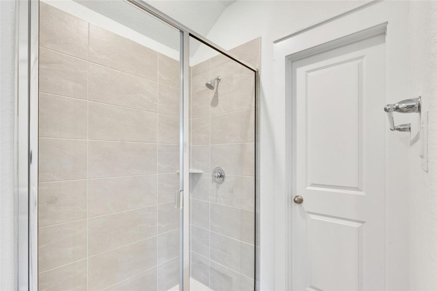 Bathroom with a shower stall Bathroom with a shower stall