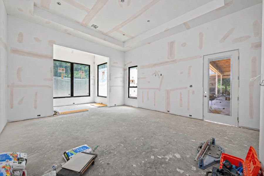 17x19 Primary suite with access to the covered patio. Ceiling will be accented with deco beams