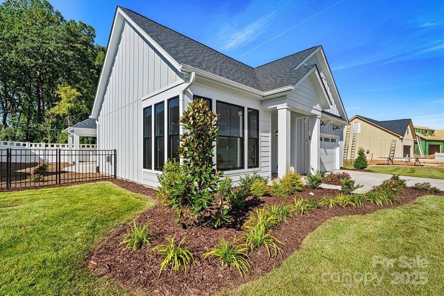Exterior details and patio area of a home in The Courtyards at Lake Davidson, Mooresville (Image 25).