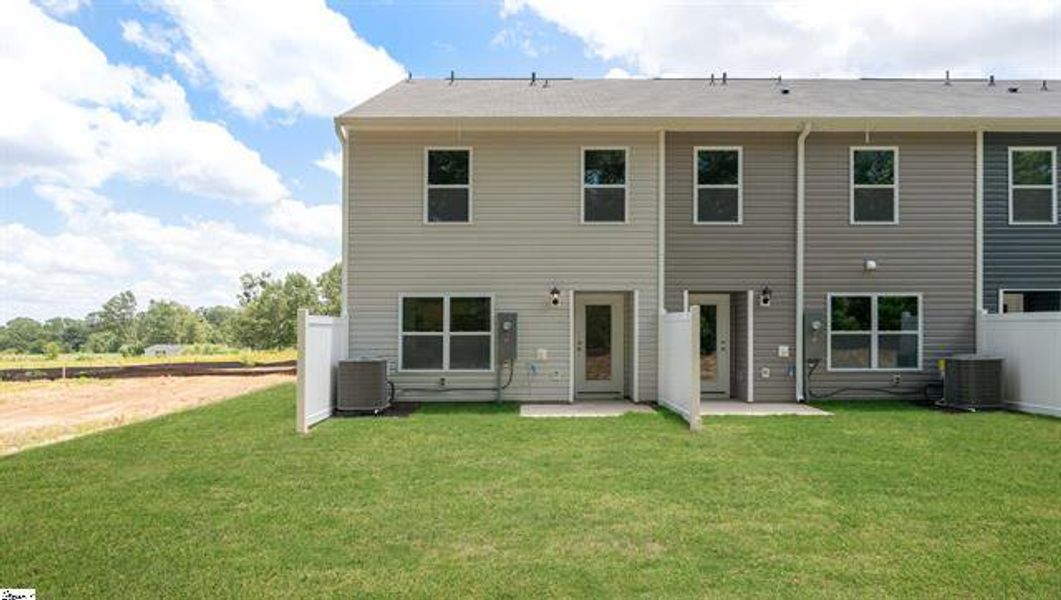 Exterior details and patio area of a home in Chestnut Ridge Townhomes, Greenville (Image 2).
