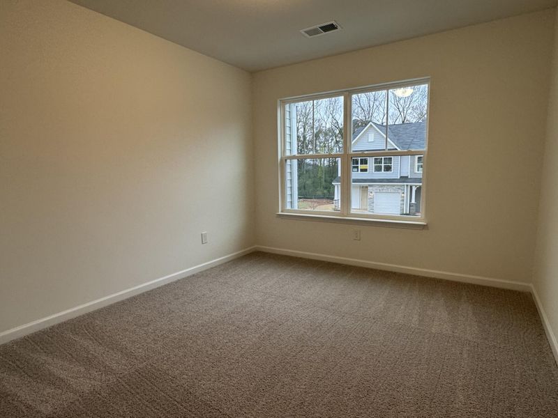 Spacious, unfurnished interior of a new home in East Main Townes, Spartanburg (Image 10).