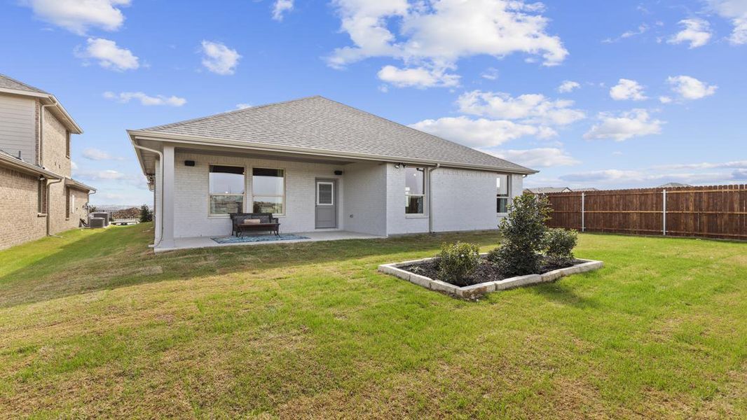 Exterior details and patio area of a home in Eagle Creek, Denton (Image 2).