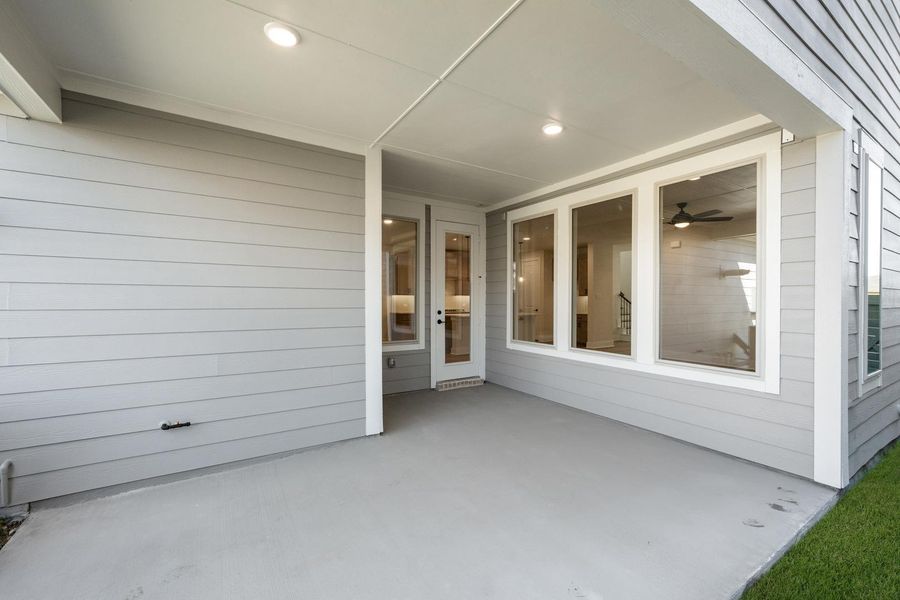 Exterior details and patio area of a home in Terrace Collection at Harvest, Argyle (Image 3).