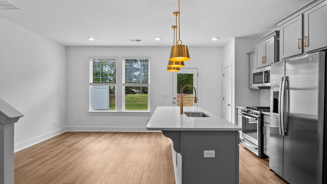 Accomplished design in a kitchen that blends function and form with a right-sized island located in Spartanburg, SC