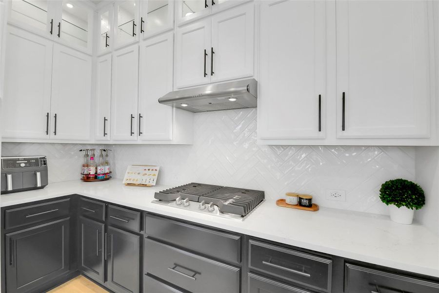Gas Cook Top, Stainless Vent Hood, Herringbone Back Splash layout