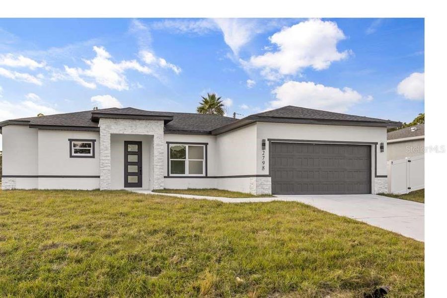 Front exterior of a new home in , Palm Bay, FL, highlighting curb appeal (Image 2). Front exterior of a new home in , Palm Bay, FL, highlighting curb appeal (Image 2).
