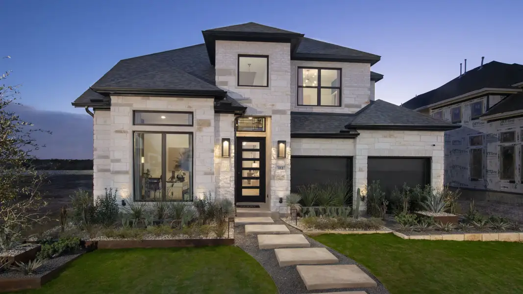 Front exterior of a new home in Grange, Katy, TX, highlighting curb appeal (Image 2). Front exterior of a new home in Grange, Katy, TX, highlighting curb appeal (Image 2).