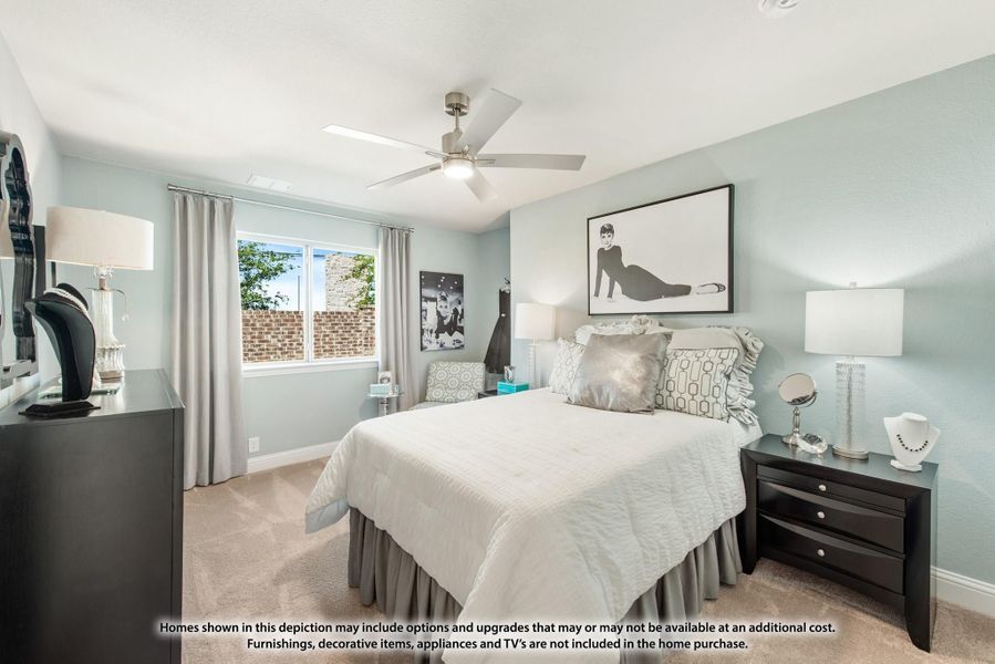 Bedroom with ceiling fan, light blue walls, carpeted floor, and large window with gray curtains Bedroom with ceiling fan, light blue walls, carpeted floor, and large window with gray curtains