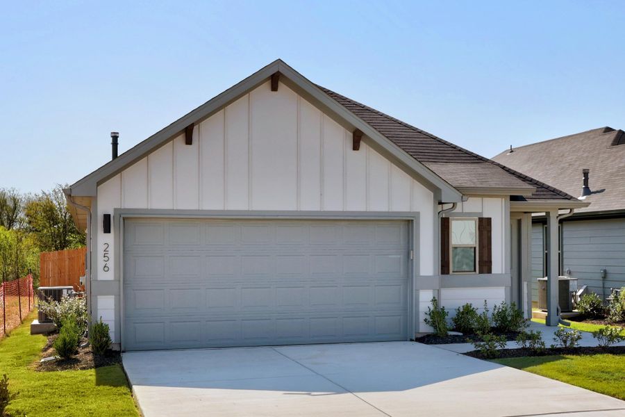 Front exterior of a new home in Trinity Ranch, Elgin, TX, highlighting curb appeal (Image 20).