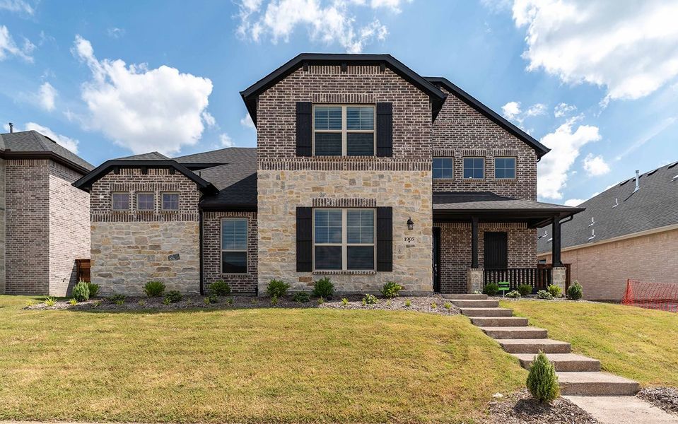 Front exterior of a new home in Solterra, Mesquite, TX, highlighting curb appeal (Image 1). Front exterior of a new home in Solterra, Mesquite, TX, highlighting curb appeal (Image 1).