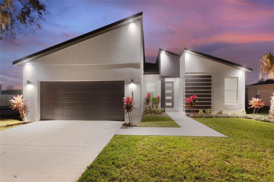 Front exterior of a new home in , Kissimmee, FL, highlighting curb appeal (Image 16).
