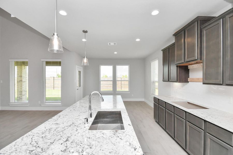 This generously spacious kitchen is a dream realized! Sample photo of completed home with similar floor plan. Actual colors and selections may vary.