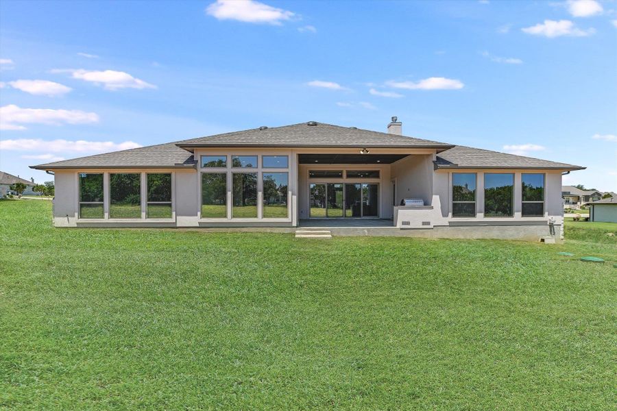 Exterior details and patio area of a home in ClearWater Ranch, Liberty Hill (Image 20). Exterior details and patio area of a home in ClearWater Ranch, Liberty Hill (Image 20).