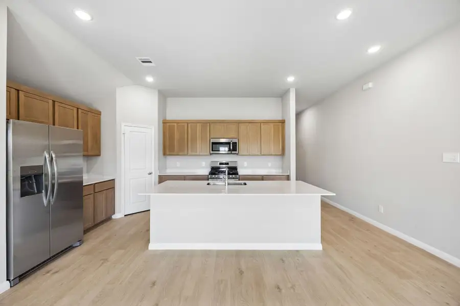 Kitchen in the Sabine home plan by Trophy Signature Homes – REPRESENTATIVE PHOTO Kitchen in the Sabine home plan by Trophy Signature Homes – REPRESENTATIVE PHOTO