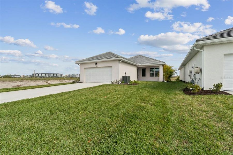 Front exterior of a new home in Vistera of Venice – Cottage Series, Nokomis, FL, highlighting curb appeal (Image 19).
