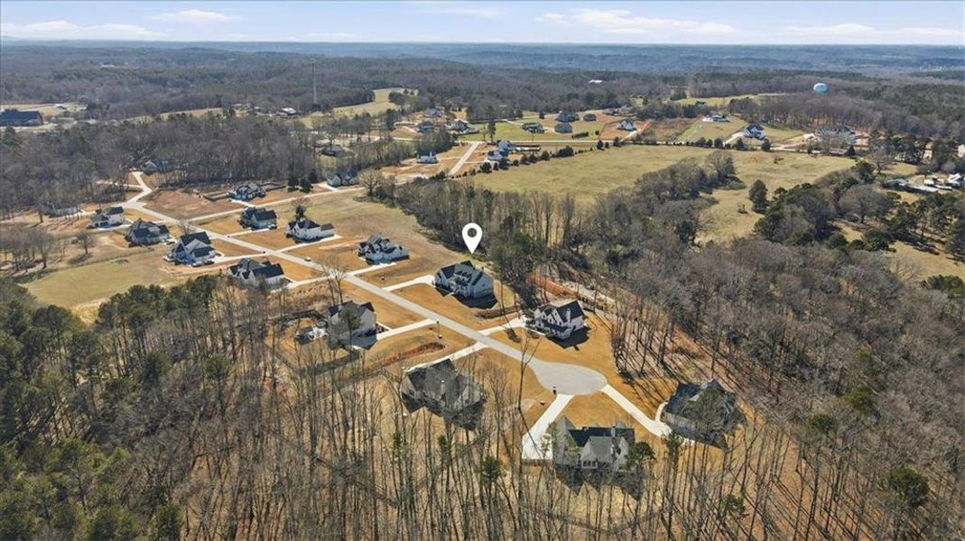 Front exterior of a new home in Old Town Estates, Dacula, GA, highlighting curb appeal (Image 32). Front exterior of a new home in Old Town Estates, Dacula, GA, highlighting curb appeal (Image 32).
