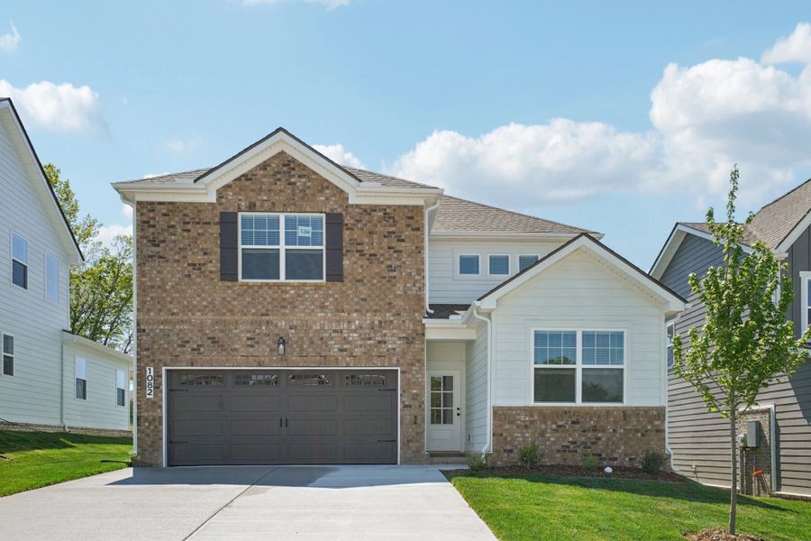 Front exterior of a new home in Ascent at Arbor Ridge, La Vergne, TN, highlighting curb appeal (Image 1). Front exterior of a new home in Ascent at Arbor Ridge, La Vergne, TN, highlighting curb appeal (Image 1).