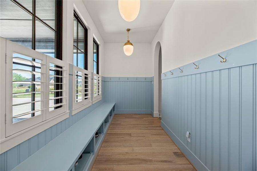 How is this for a mud room? Shelves and hooks to keep everyone organized.