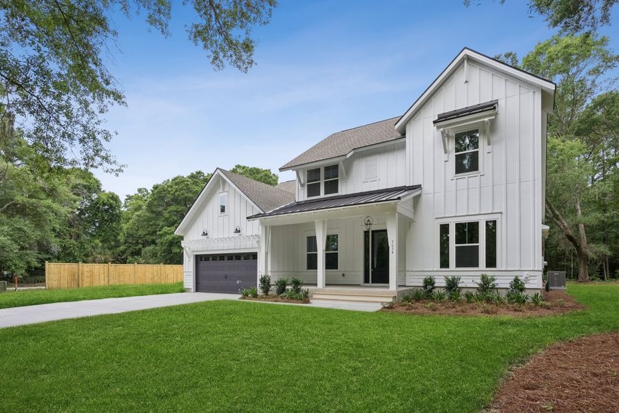 Front exterior of a new home in Discover Series - Signature, Johns Island, SC, highlighting curb appeal (Image 27). Front exterior of a new home in Discover Series - Signature, Johns Island, SC, highlighting curb appeal (Image 27).