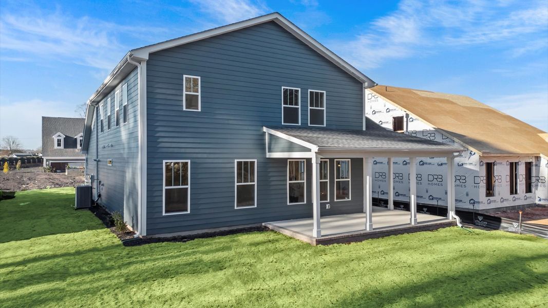 Accomplished exterior with a spacious rear porch that blends comfort and style