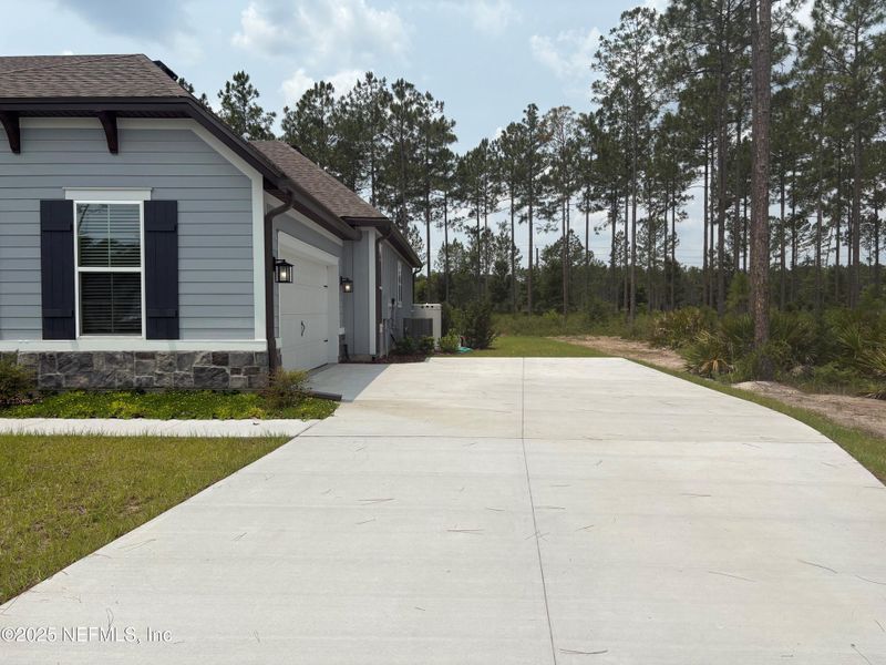 Front exterior of a new home in , Hilliard, FL, highlighting curb appeal (Image 2). Front exterior of a new home in , Hilliard, FL, highlighting curb appeal (Image 2).