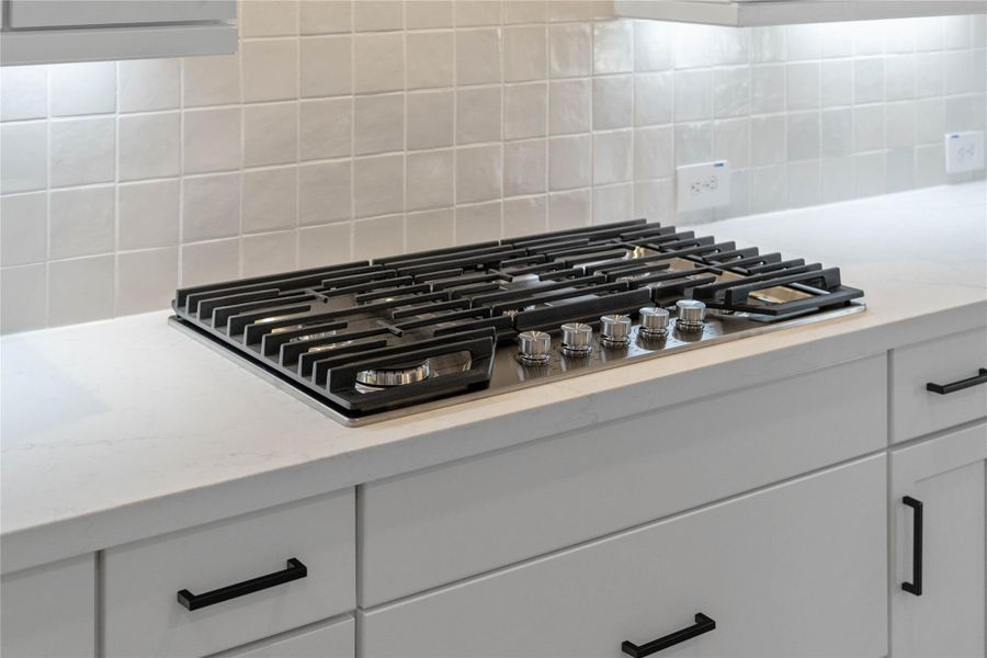 Enjoy cooking with a full suite of stainless steel appliances, including a gas cooktop with venthood, wall oven and microwave set.