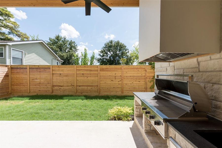 A built in grill makes the covered patio ready for outdoor cooking and entertaining, while the fenced backyard leaves plenty of open lawn for play, pets or simply enjoying the outdoors. A built in grill makes the covered patio ready for outdoor cooking and entertaining, while the fenced backyard leaves plenty of open lawn for play, pets or simply enjoying the outdoors.