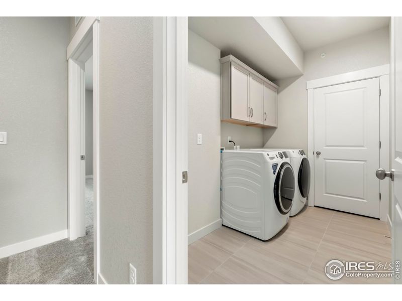 Oversized, dedicated laundry room by all the bedrooms!