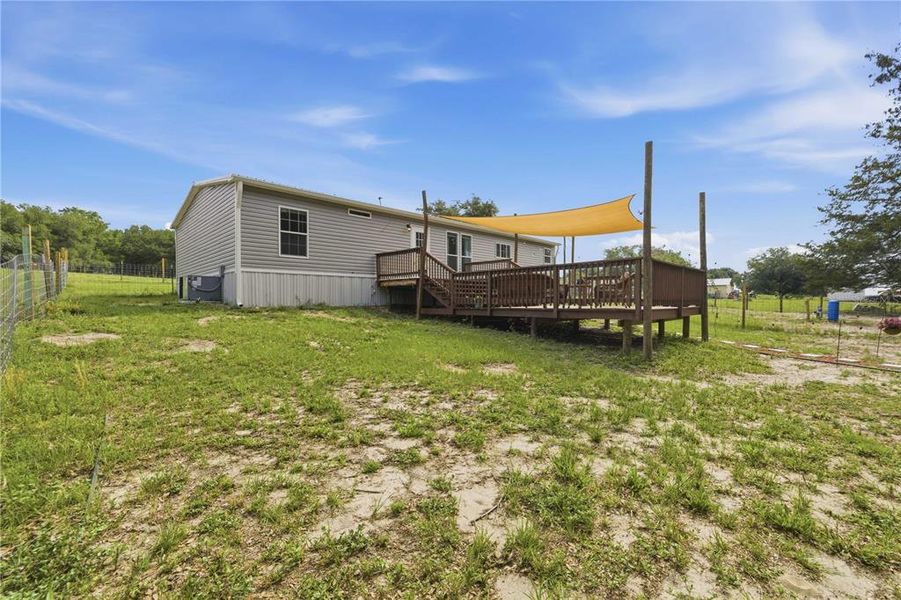 Exterior details and patio area of a home in , Weirsdale (Image 22).
