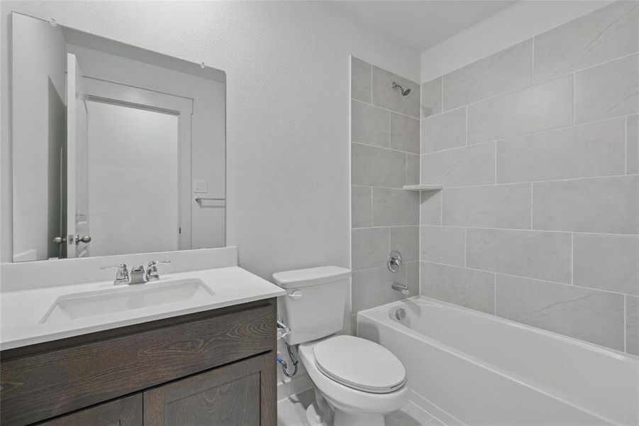 Full bathroom featuring vanity and tub / shower combination Full bathroom featuring vanity and tub / shower combination