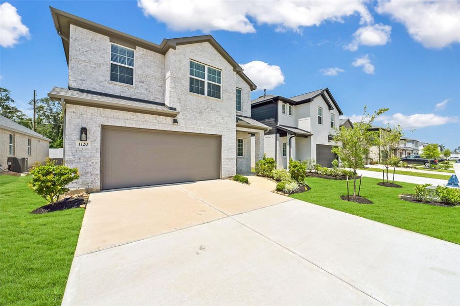 Front exterior of a new home in Saint Tropez, Houston, TX, highlighting curb appeal (Image 20). Front exterior of a new home in Saint Tropez, Houston, TX, highlighting curb appeal (Image 20).